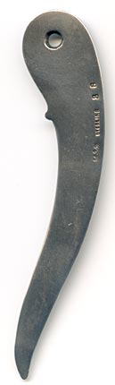 This bookmark was made in the US by Gorham. It is marked with the makers hallmark, sterling and the number 38. It only has one blade with a flower at the top and is one of 33 bookmarks sold in the Autumn 1888 silver catalog. 