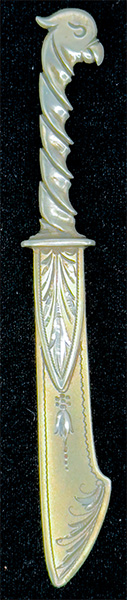 This bookmark was made in the US by Gorham Mfg. Company. It is marked with the manufacturers mark, sterling 28 and a crown (indicating 1879). 28 is the number from the Autumn 1888 catalogue. The top is a figural bird.
