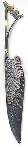 This is an American made bookmark. The manufacturer is Gorham. It is marked with the manufacturers hallmark, Sterling and the catalog number 15. It large and heavy for a bookmark. It has the picture of a feather. It's nicely detailed. It is from the Autumn 1888 Gorham Catalog. It is one of 33 different bookmarks offered that year. 