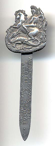  This bookmark was made in the US by an unknown manufacturer. It is marked sterling on the back. This was a Christmas giveaway souvenir. The blade is embossed with "Merry Christmas 1901 * Hotel St. George * Brooklyn Heights, N.Y." The top depicts St. George slaying the dragon. The date is 1901.   