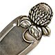 This bookmark was made in the US by Parks Bros. & Rogers. It is marked with the manufacturers hallmark surrounded by the word sterling. The top is a figural flower. The date is 1900 - 1910.  