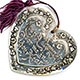 This bookmark was made in the US by an unknown manufacturer. It is marked only sterling. It is a heavy figural heart with flowers around the outside blade. The inner blade has the words, "Keep a thought for me in your heart." The date is 1890 - 1900.