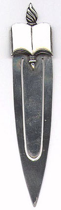 This bookmark is American made by The Napier Company. It is marked Napier Sterling. The top of the bookmark is in the shape of a book (possibly a bible) and a torch. The date is somewhere after 1922.