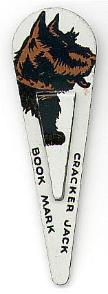 This bookmark is one of a set of 4 from Cracker Jack. It is made of tin and paint depicting a Scotty dog. It was made it the 1940's.