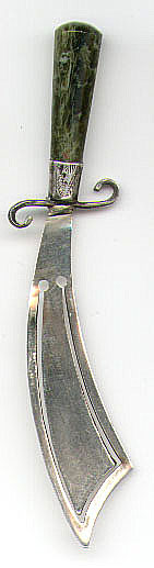 This bookmark was made in Birmingham England in 1894 by the date mark. The manufacturer mark is too warn to make out. The handle is made of green marble.