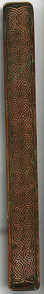 This bookmark was made in the US possibly by Louis Comfort Tiffany, of the Tiffany lamp fame. It was part of a desk set made of copper. The date is probably late 1890's - 1910.