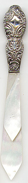 This bookmark is from Birmingham, England. It is marked G.E.W with a date mark of "e" indicating the year 1904. The top is silver and the blades are mother of pearl.
