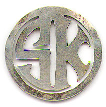 This bookmark was made in the US possibly by S. Kirk and Sons. It is a circle with the initials SK in the center as the middle blade. The date is unknown.