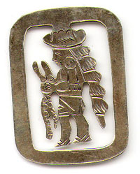 This bookmark was made in Mexico. It is marked with some words that can't be made out and the national silver mark with the number 23 inside (identifying the maker). The center blade is an Indian figure holding two snakes. The date is 1920 - 1940.
