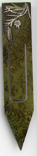 This bookmark was made in the US by the Heintz Art Metal Shop between 1910 - 1930. It is an Arts and Crafts design with a silver design on the top and a green florentine patina over brass. It is unmarked.