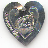  This bookmark was made in the US by an unknown manufacturer. It is marked only Sterling and is in the shape of a heart. The center blade has an engraving of Plymouth Rock and the date 1620. The date is 1930 - 1950.  