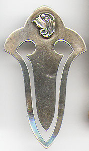 This bookmark was made in Denmark by Georg Jensen. It is marked Georg Jensen, Inc. Sterling on the back. The top has an Art Deco flower. The date is 1940 - 1945.   
