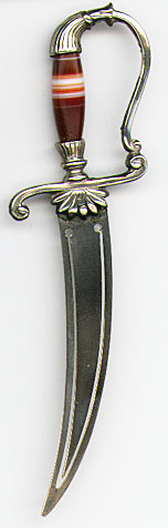  This bookmark was made in Scotland by an unknown manufacturer. It is in the shape of a sword with a banded agate handle. It is silver plate. The date is 1900 - 1910.   