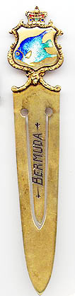 This bookmark was made in the US by an unknown manufacturer. It is marked only sterling on the back and is finished in a gold wash. The top is an enameled fish within a shield. The blade is marked Bermuda. The date is 1960 - 1970.  
