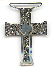 This bookmark was made in the US by Webster Co. It is only marked Sterling on the back. It is a figural cross with an art nouveau design. It is missing a ribbon that was originally attached to the top loop. The date is 1913.