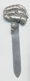  This bookmark was made in the US by Unger Brothers. It is hallmarked with the manufacturers mark of the intertwined U and B. The top is a carnation flower.  