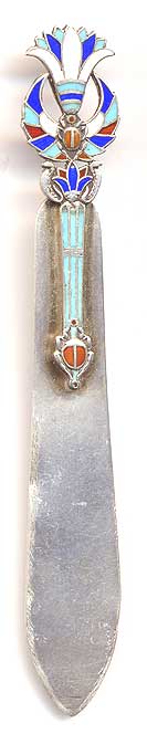  This bookmark was made in Europe, possibly Spain. It is marked 800 on the back, indicating the purity of the silver. 925 is sterling. The bookmark was once finished in a gold wash which has since worn off. The top has a 4 color enamel Egyptian motif design. The date is 1900 - 1920.   